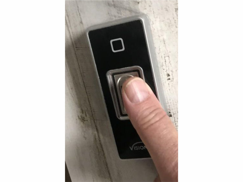Biometric thumbprint reader for hidden door