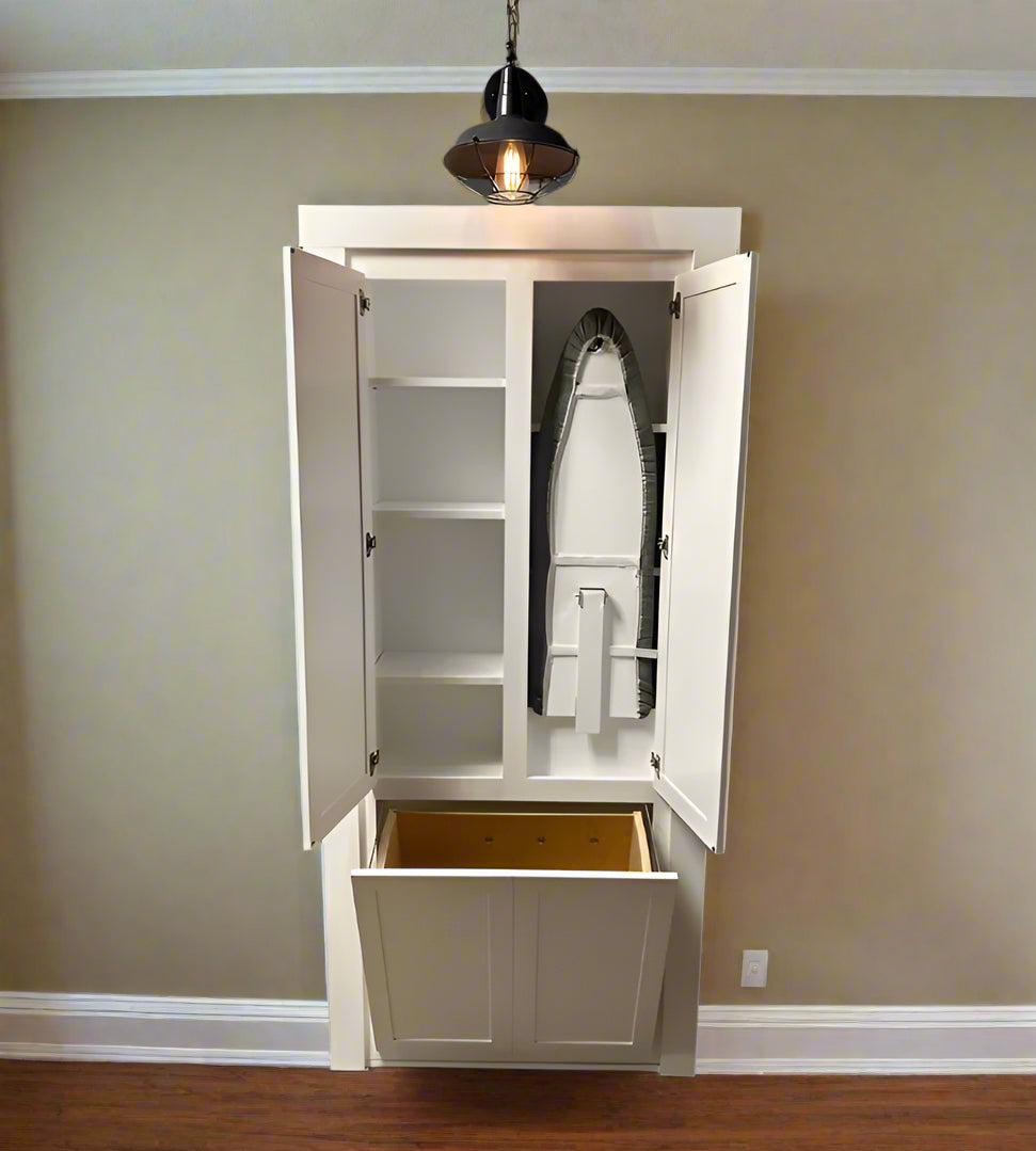 laundry room hidden door with ironing board and hamper